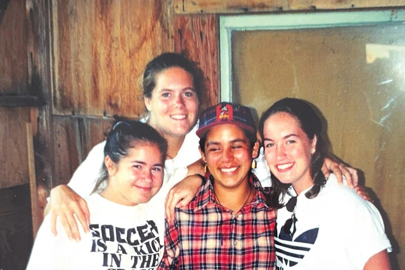 1998 Polaroid of 4 smiling friends- 3 white women volunteers and 1 brown skinned Mexican woman