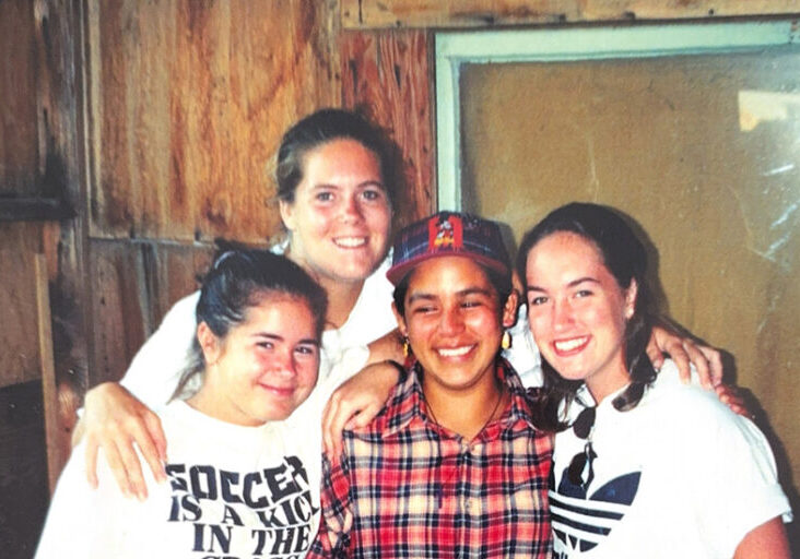1998 Polaroid of 4 smiling friends- 3 white women volunteers and 1 brown skinned Mexican woman